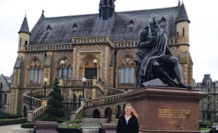 Emily Tyrrell in front of a statue of Robert Burns.