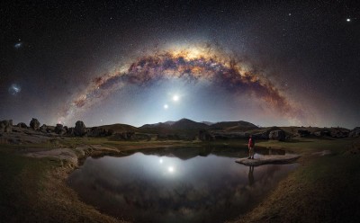 Astrophotography photograph taken by Thomas Rae that shows the night sky, stars, lake and wider landscape.