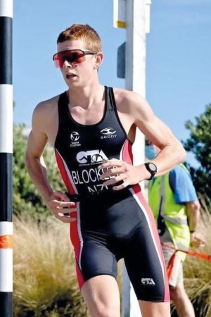 Max is photographed as he is competes in the running portion of the triathlon,