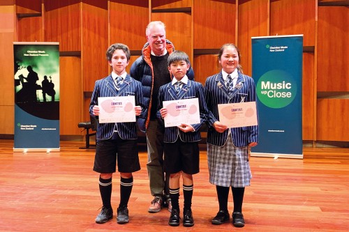 Conductor, Mark Hodgkinson, with with chamber group Hidin’ in Strowan – Ethan Waines, Baizhen (Tony) Chen, and Lexie Dong (all Year 7).
