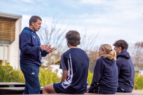 Joining the Sports Leadership and Development team is John Haggart, pictured chatting with Year 10 students from the Athlete Sports Development programme.