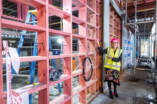 Rector, Christine Leighton, inspecting progress inside the new Performing Arts Centre.