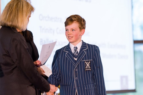 Austen Fraser (Year 6) accepting an award at assembly.
