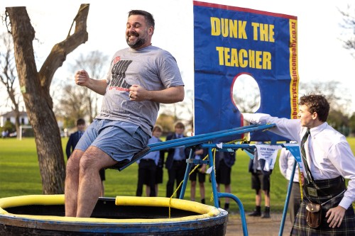 Head of Middle School, Matt Parr, being dunked as a prize after a student competition to donate the most clothing to charity, Clothed in Love.