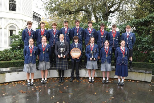 Photo of rowing squad with their medals and awards from 2023.