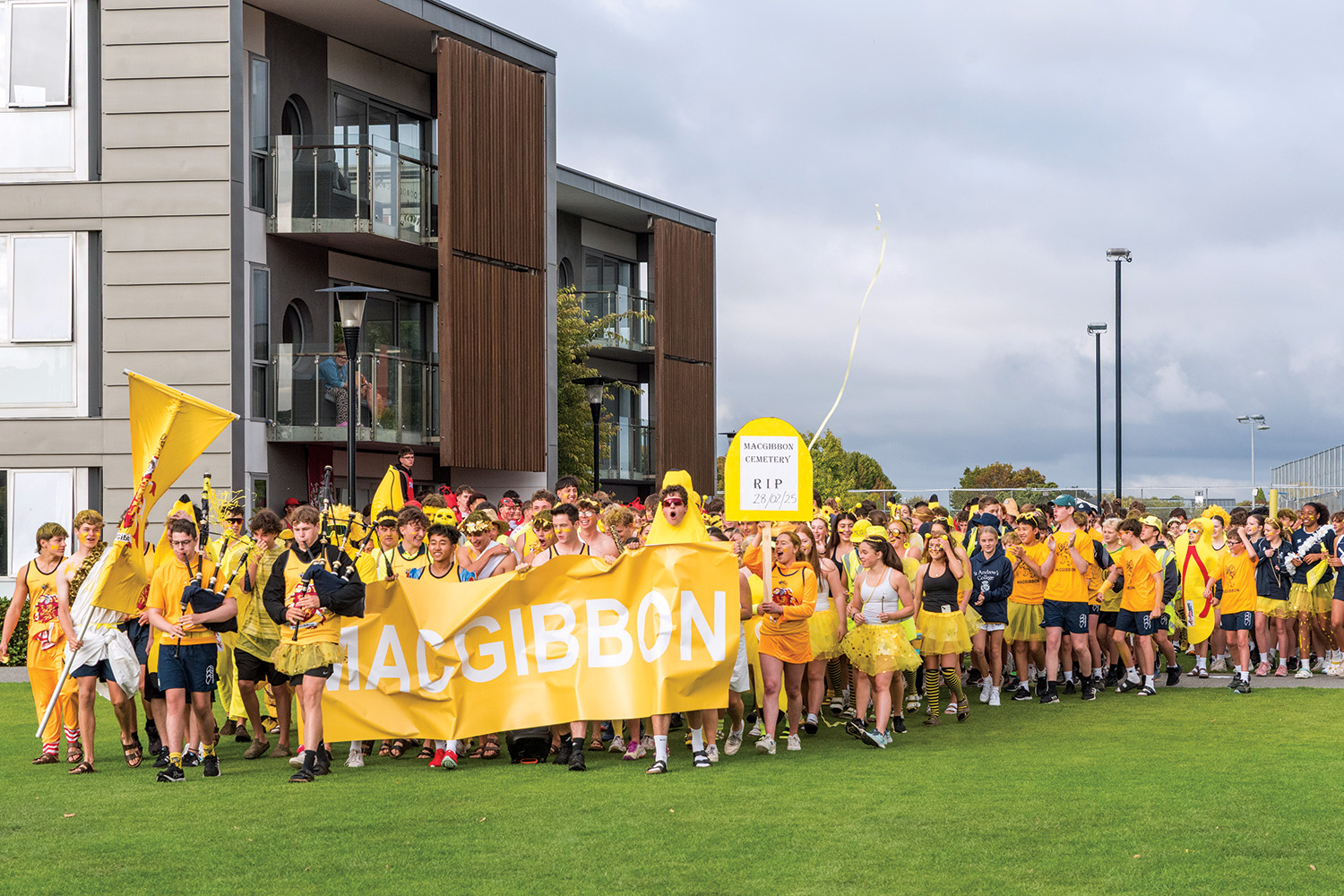 St Andrew's College students cheering for MacGibbon House at the annual Athletic Sports Day.