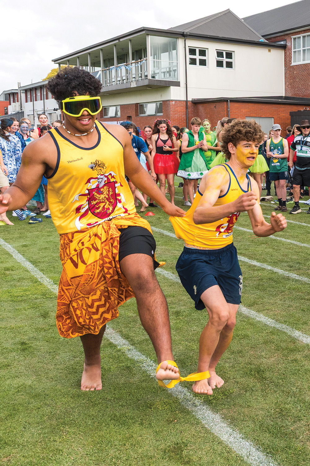Two St Andrew's College students dressed in MacGibbon House colours at the annual Athletic Sports Day.