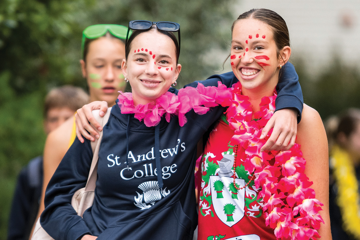 Two St Andrew's College students dressed in Erwin House colours at the annual Athletic Sports Day.