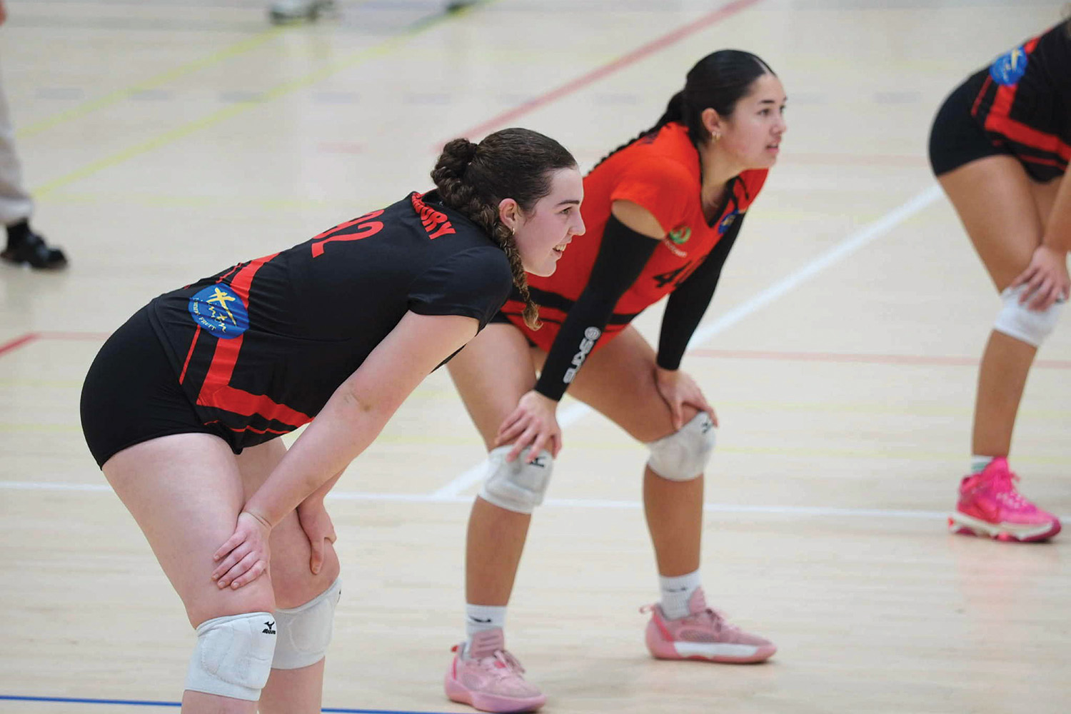 St Andrew's College students Catherine Cook and Mia Montgomery playing volleyball.