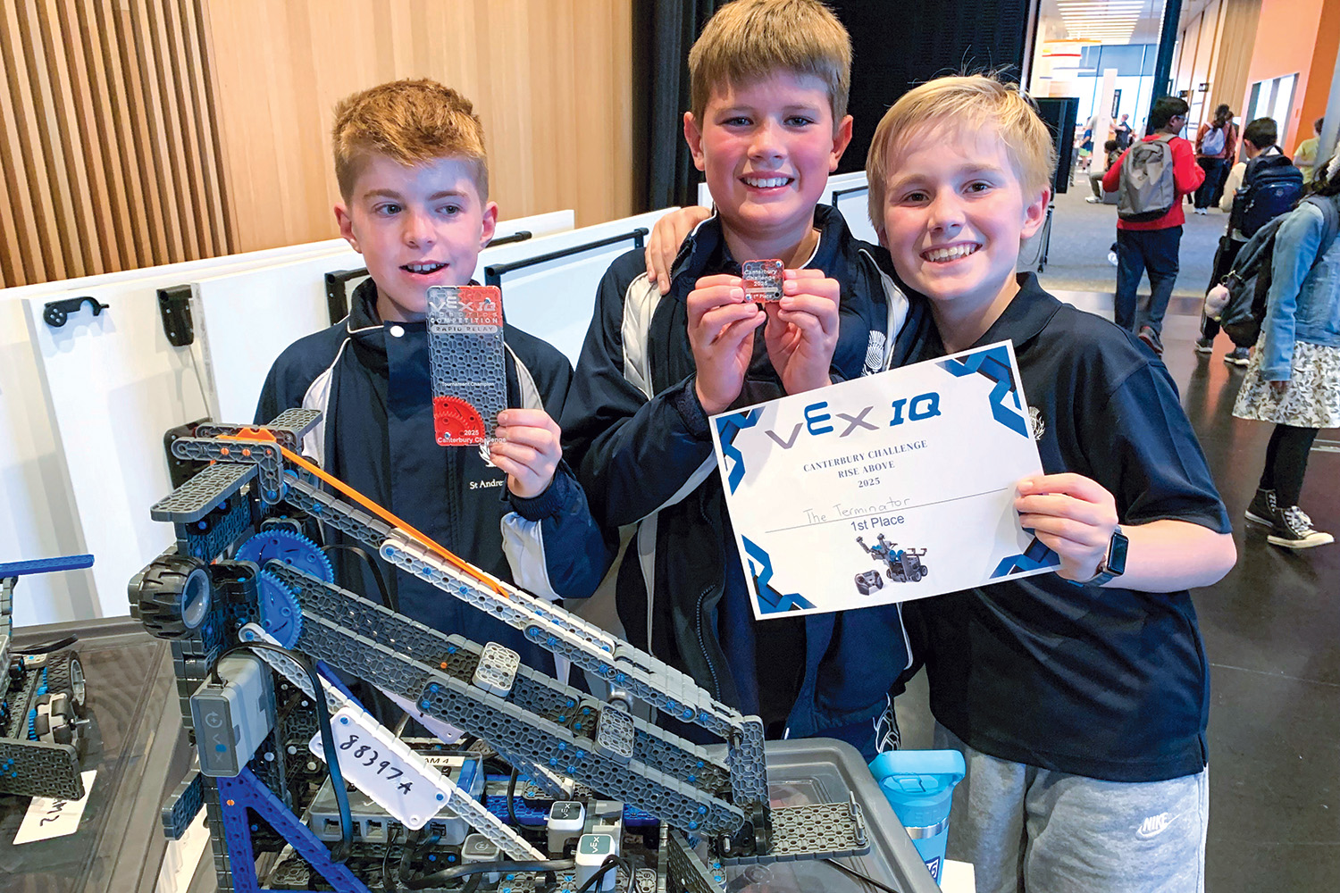 St Andrew's College students William Keir, Jack Blyde and Carter Robinson at the finals of the annual VEX Robotics Canterbury Challenge.