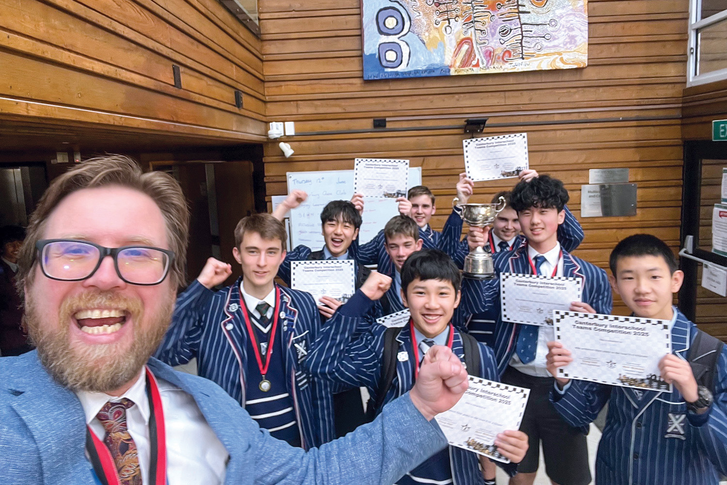 St Andrew's College teacher Jon Fahlander, with members of the Secondary School chess teams.