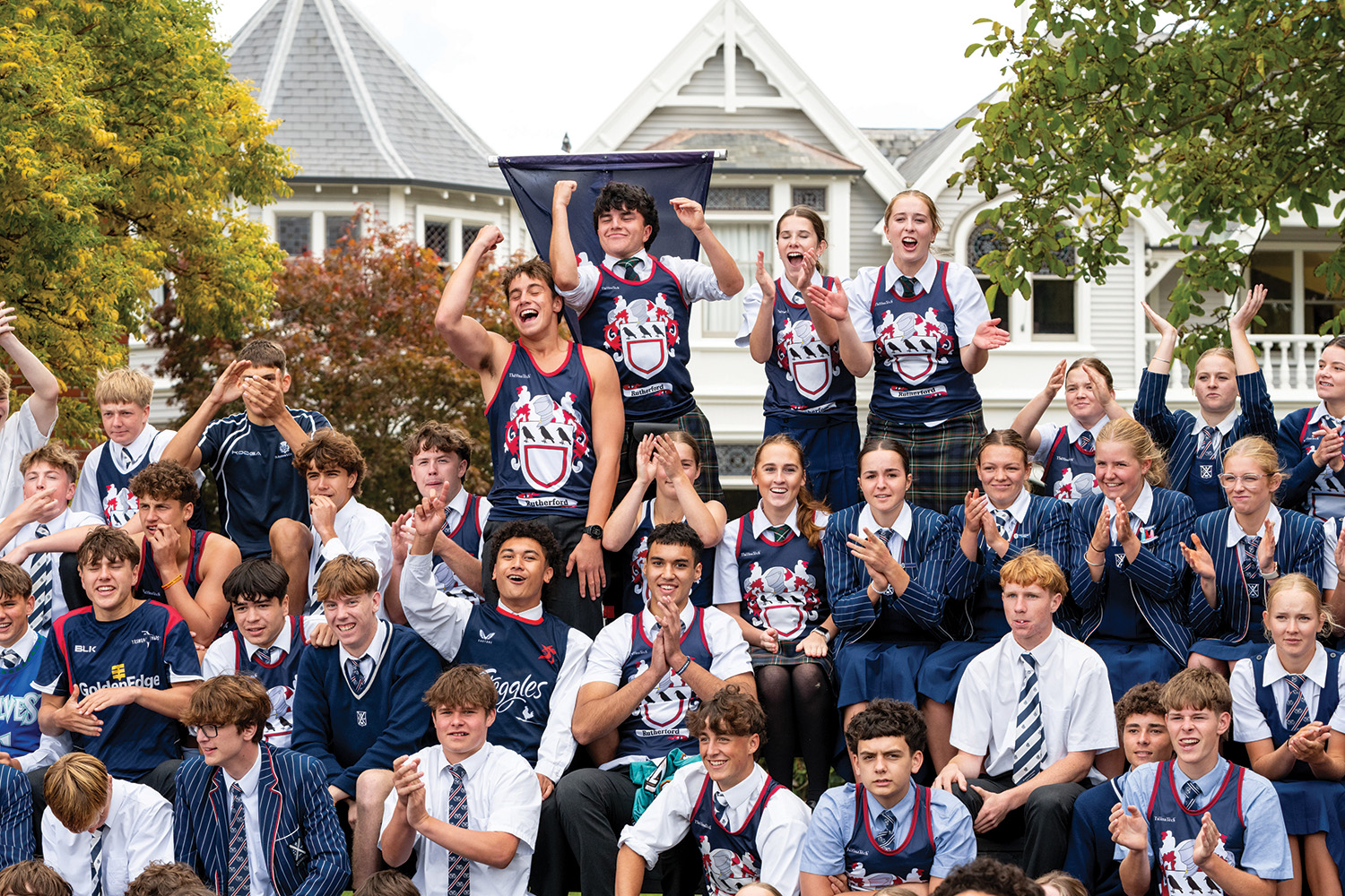 St Andrew's College students cheering dressed in Rutherford House colours at the annual Highland Games.