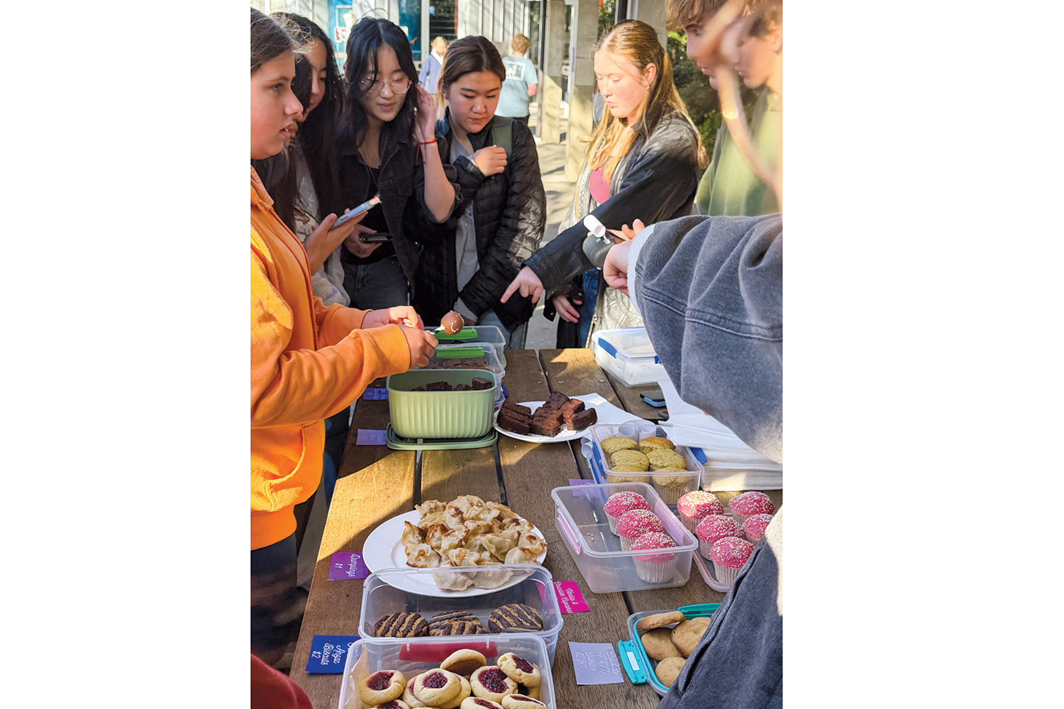 St Andrew's College students holding a bake sale raising funds for Youth Hub Christchurch during Well-being Week.