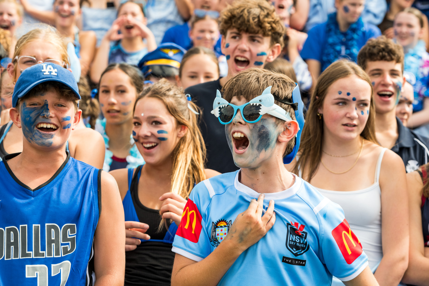 St Andrew's College Secondary School students chanting dressed in blue at the Athletics Sports Day.