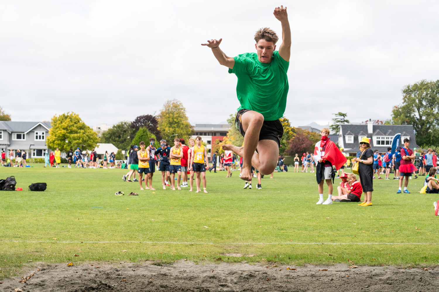 St Andrew's College Secondary School student long jumping at the Athletics Sports Day.