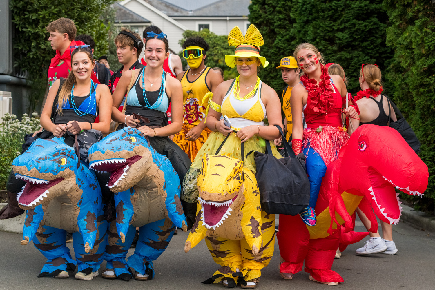 St Andrew's College Secondary School students dressed in blue, yellow and red at the Athletics Sports Day.