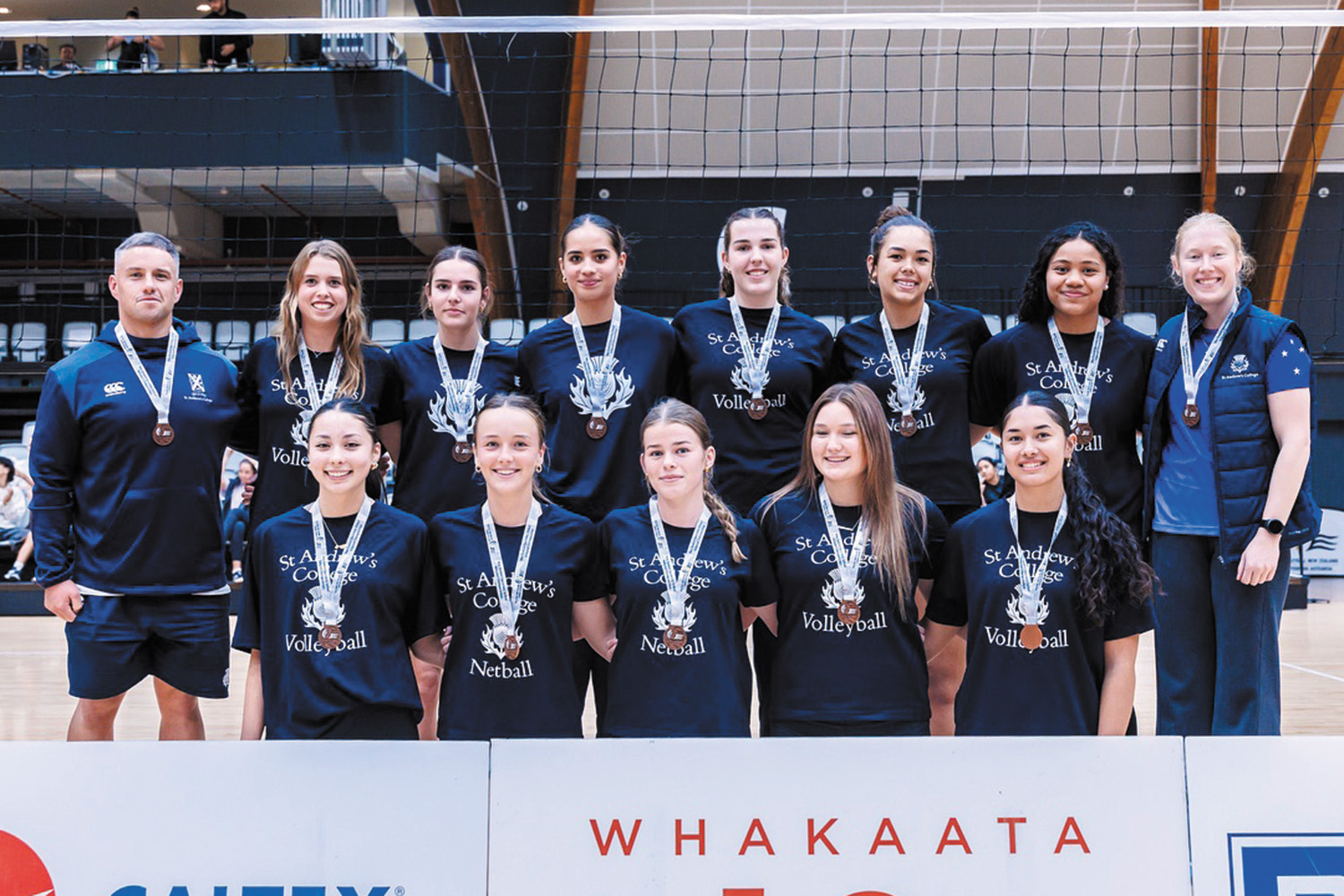 St Andrew's College Girls’ Senior A volleyball team with their Manager and Coach.