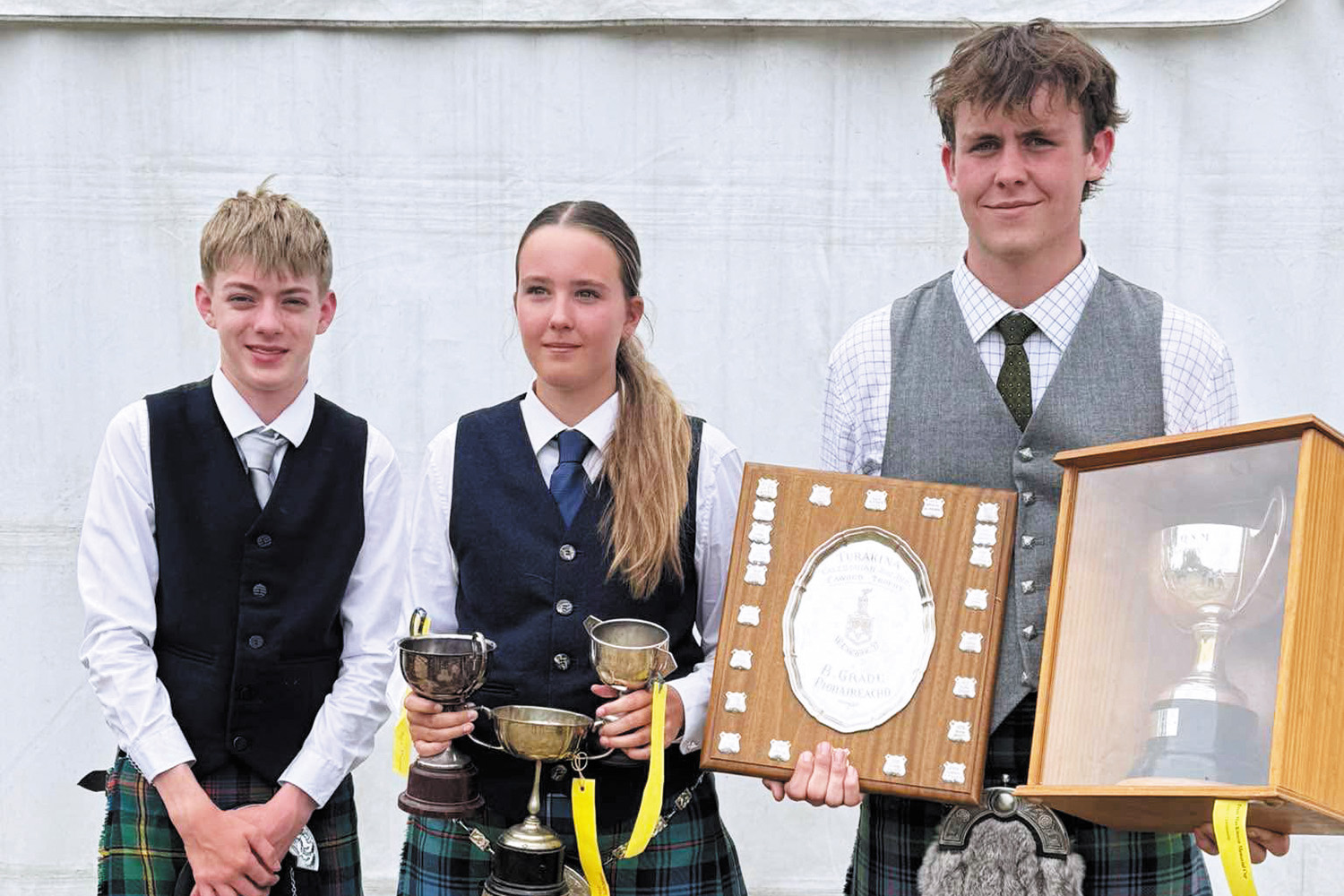 St Andrew's College students Williams Nicholls, Maggie McConnochie and Sam Foote after their wins at the Turakina Highland Games.