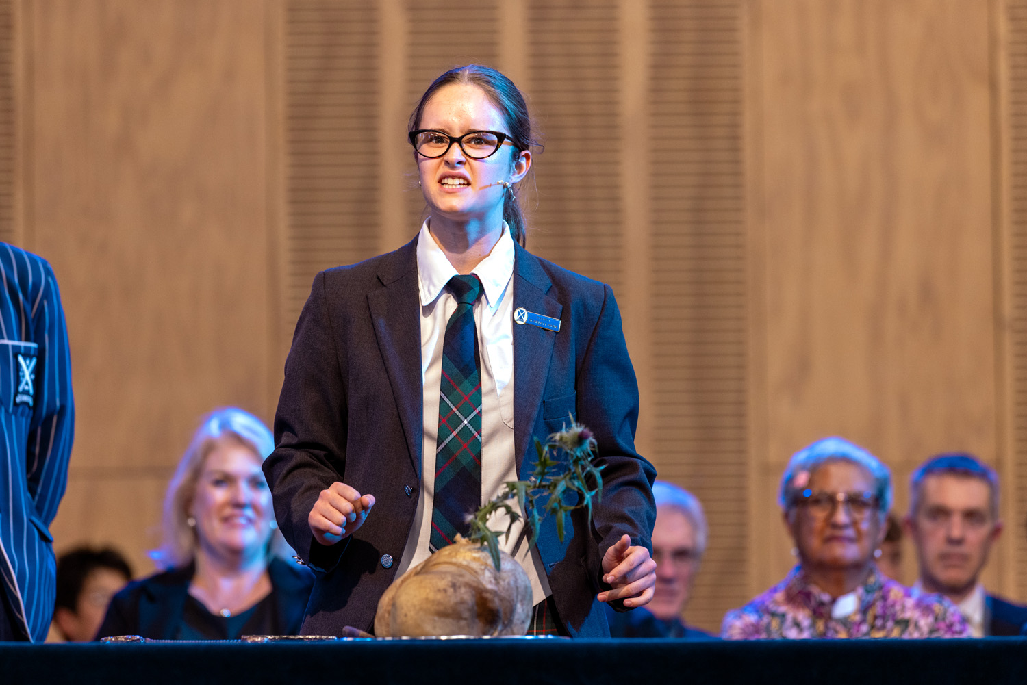 St Andrew's College student Scarlett Ryan performing of Address to a Haggis at the 2026 Founders' Day Assembly.