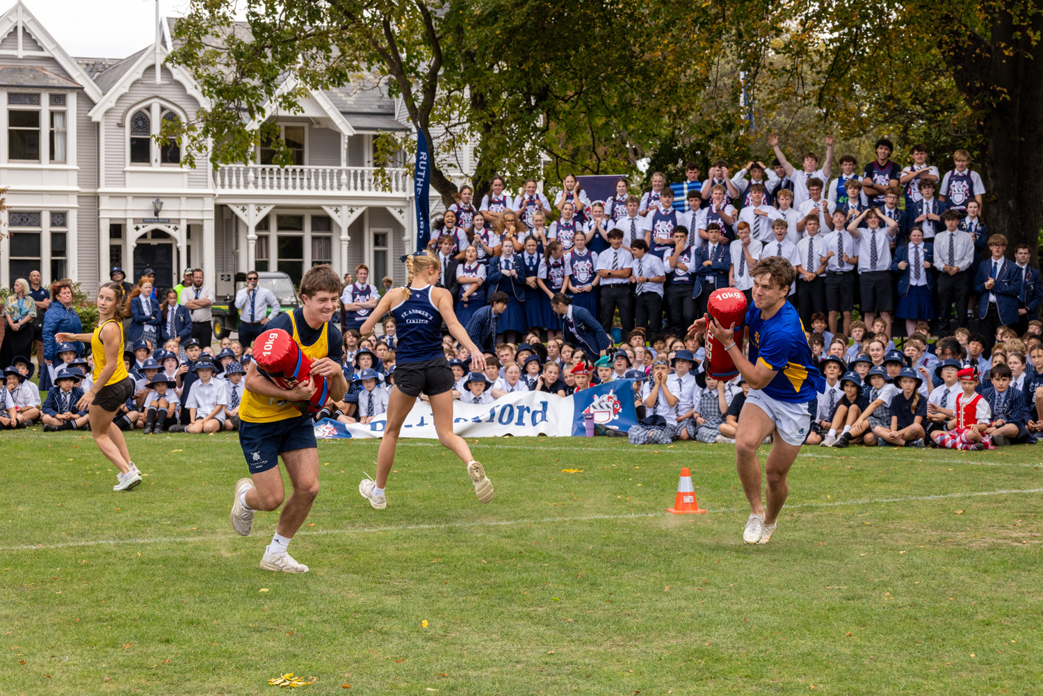 St Andrew's College students competing in dead lift and carry at the 2026 Highland Games