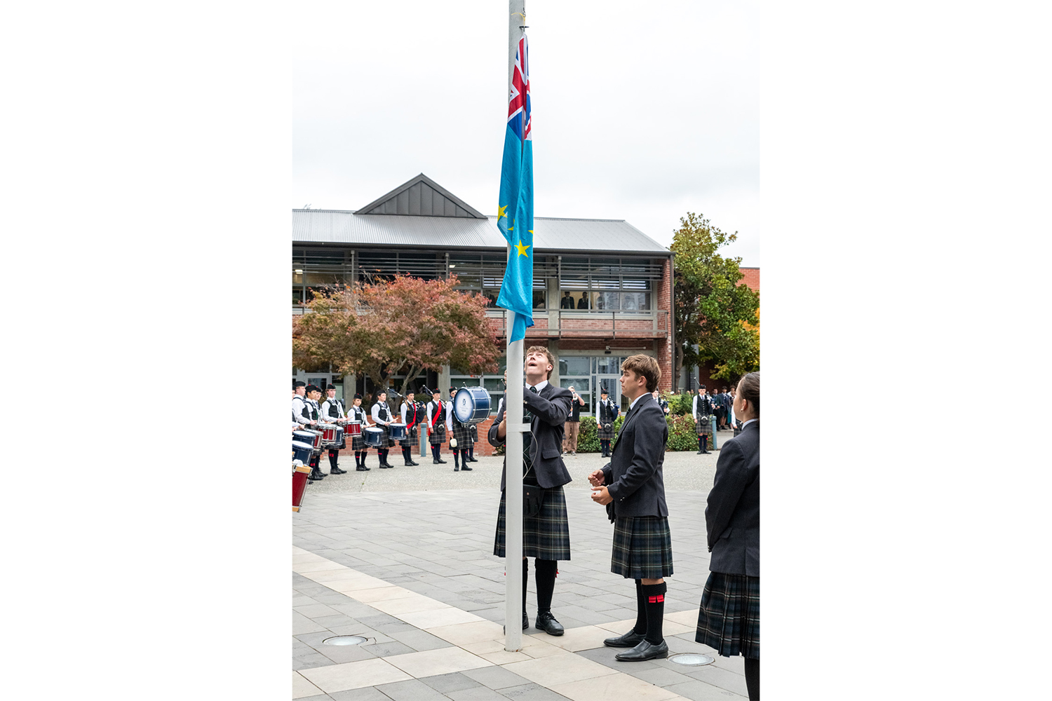 St Andrew's College Head Students raising the flag of Tuvalu in honour of The Honourable Feleti Teo OBE (OC 1982), Prime Minister of Tuvalu.