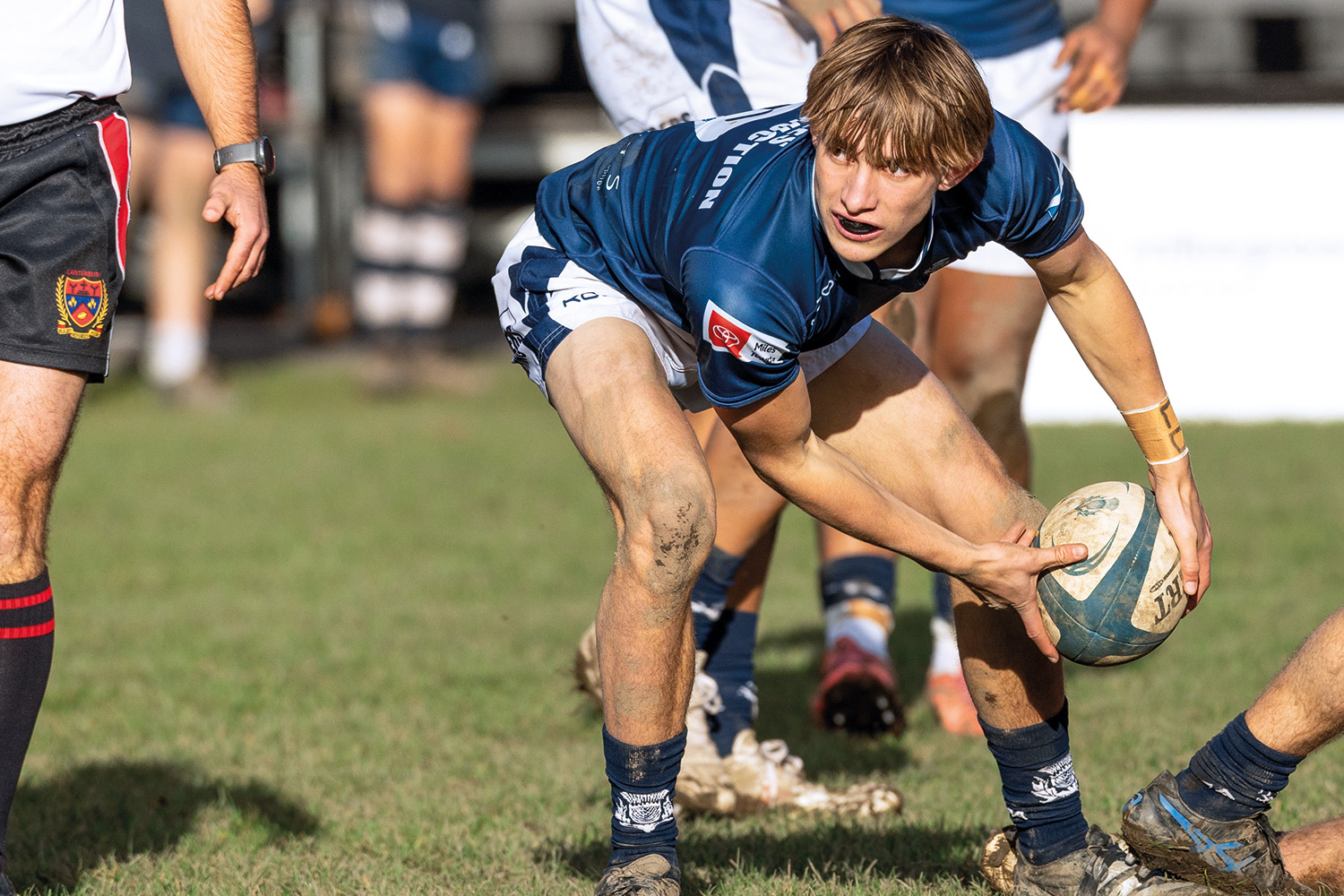 St Andrew's College student playing rugby