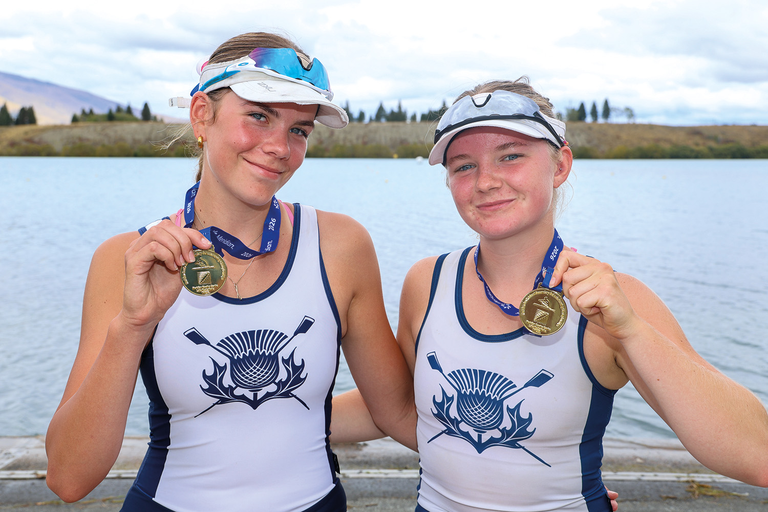St Andrew's College students Alanna Brook and Lauren Bolton with their gold medals at the South Island Secondary Schools&rsquo; Rowing Championships.
