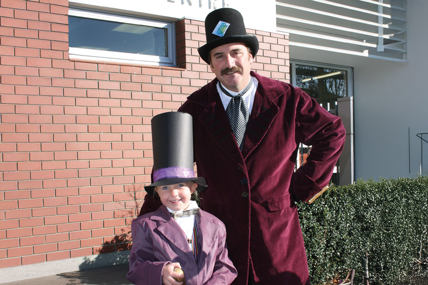 St Andrew's College Principal of Preparatory School Jonathan Bierwirth with a student, dressed up as Willy Wonka for Book Week.