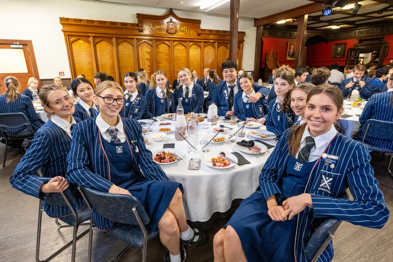 St Andrew's College students sitting at a table at the 2025 Leavers' Breakfast.