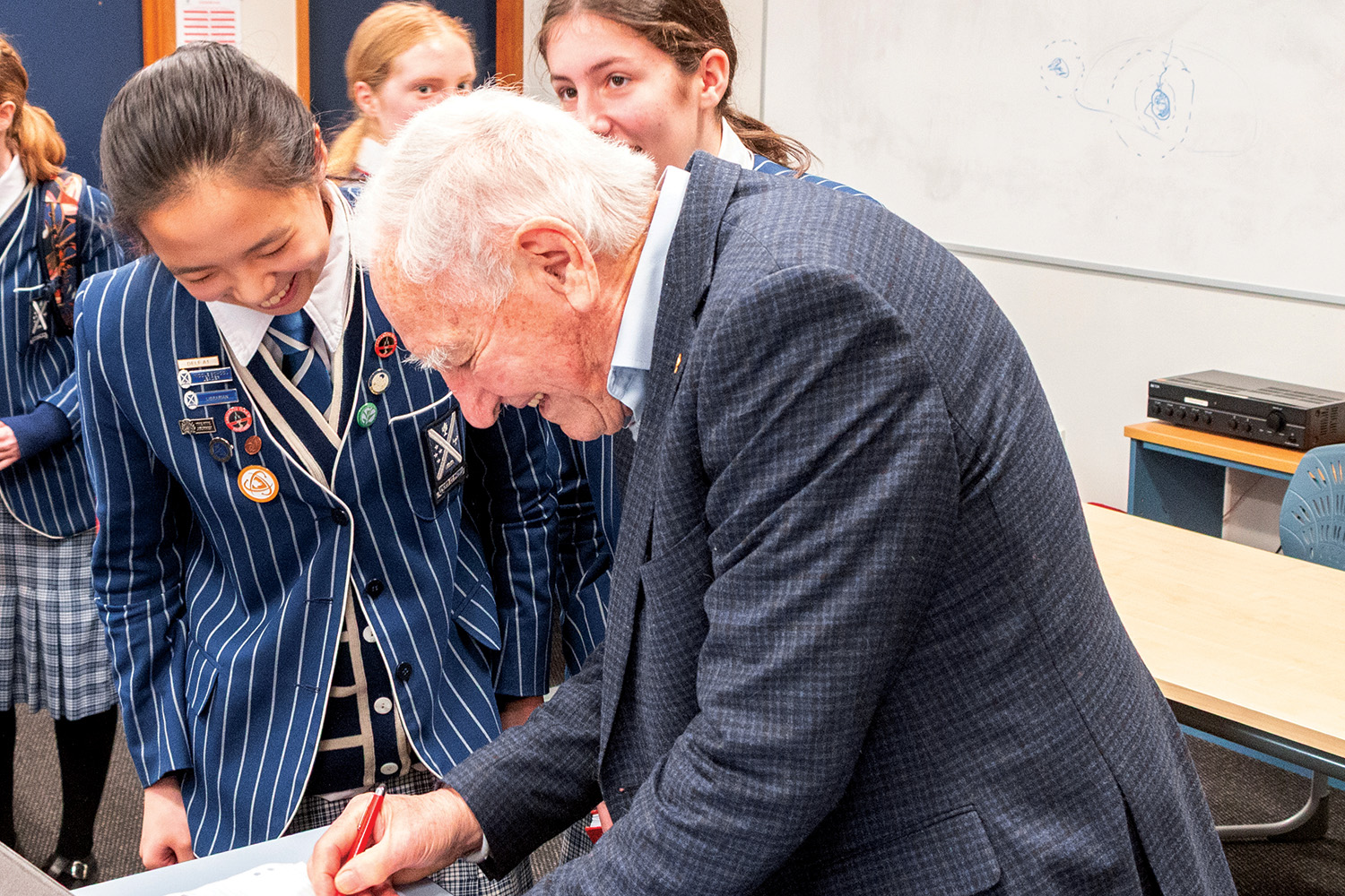 Mathematics Club students lining up for Professor Kerr’s autograph.