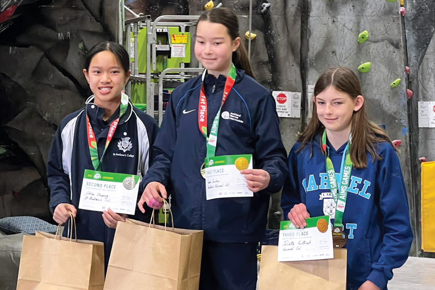 St Andrew's College student Chloe Chuang (Y8) left, won silver in rock climbing at the AIMS Games.