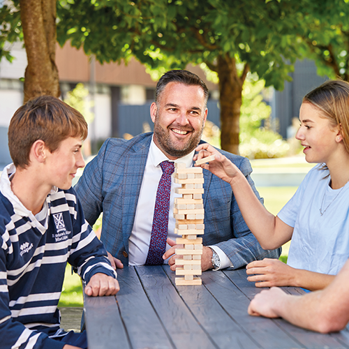 St Andrew's College Director of Boarding Matt Parr with students.