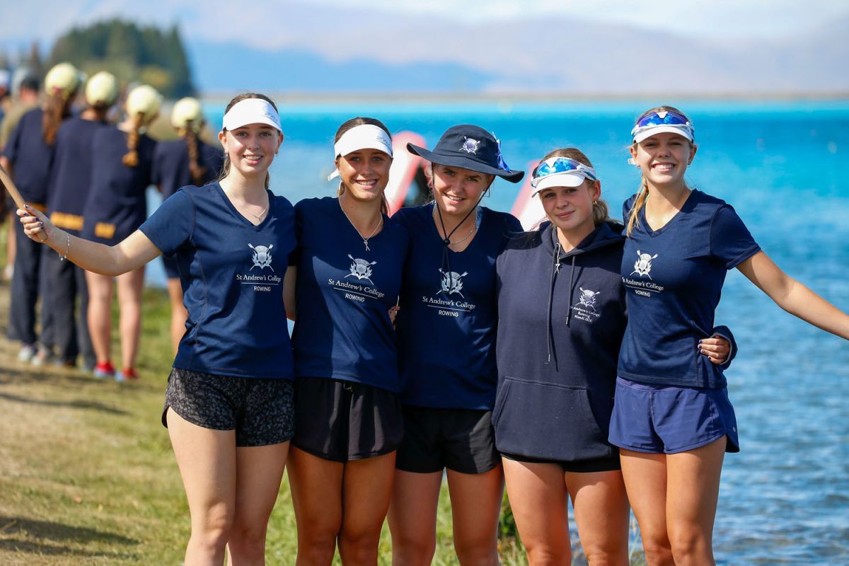 A group of female St Andrew's College students at a rowing regatta.