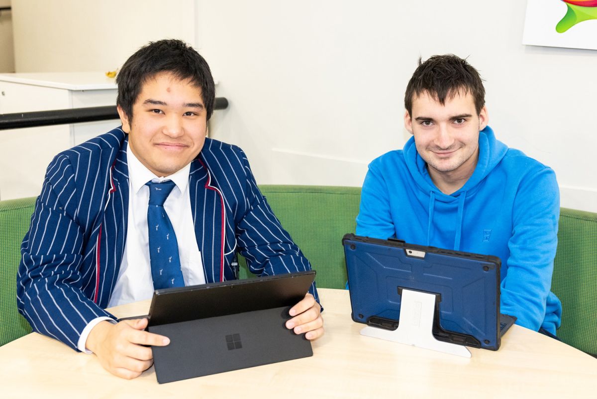 Two St Andrew's College students working together.