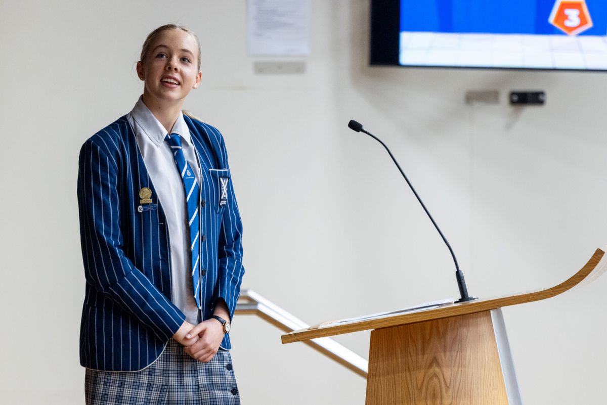 A St Andrew's College Secondary School student giving a presentation.