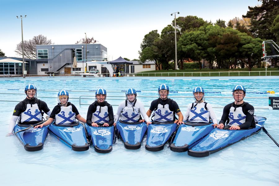 St Andrew’s College canoe polo team in their canoes.