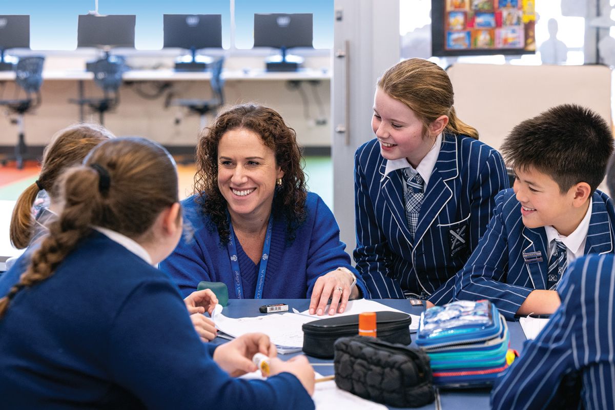 St Andrew's College Teacher, Bid Constanti, working with students of class 6T.