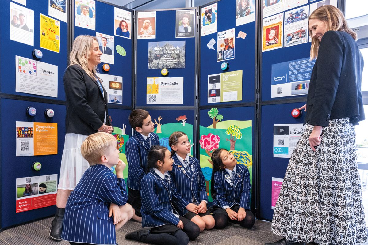 Head of Learning Support in the Preparatory School, Irene Cronan chats with Head of Middle Syndicate, Megan Feller, and five Year 4 students about the neurodiversity display.