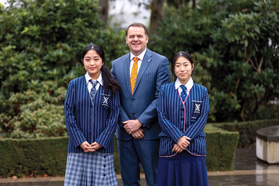 St Andrew's College Rector, Mark Wilson, with Ellarose Wang (Year 10, left) and Ellie Zhou (Year 13)