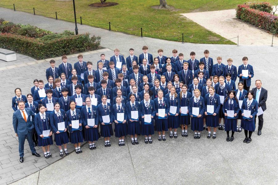 St Andrew's College Year 12 students who placed in the top percentile in New Zealand, with Rector and Principal of Secondary School.