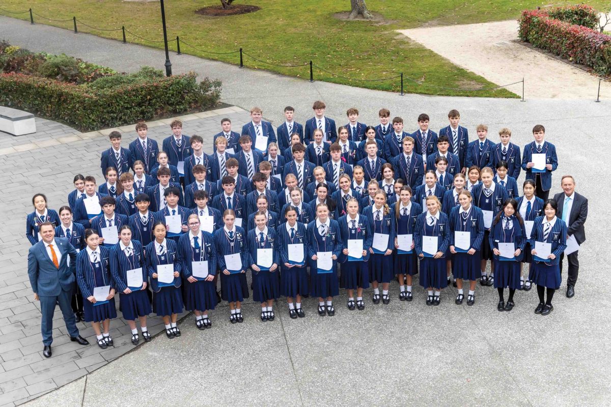 St Andrew's College Year 12 students who placed in the top percentile in New Zealand, with Rector and Principal of Secondary School.
