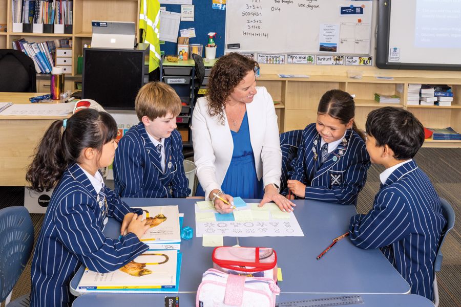 St Andrew's College Year 6 teacher, Bid Constanti, with students during an Oxford Maths lesson.