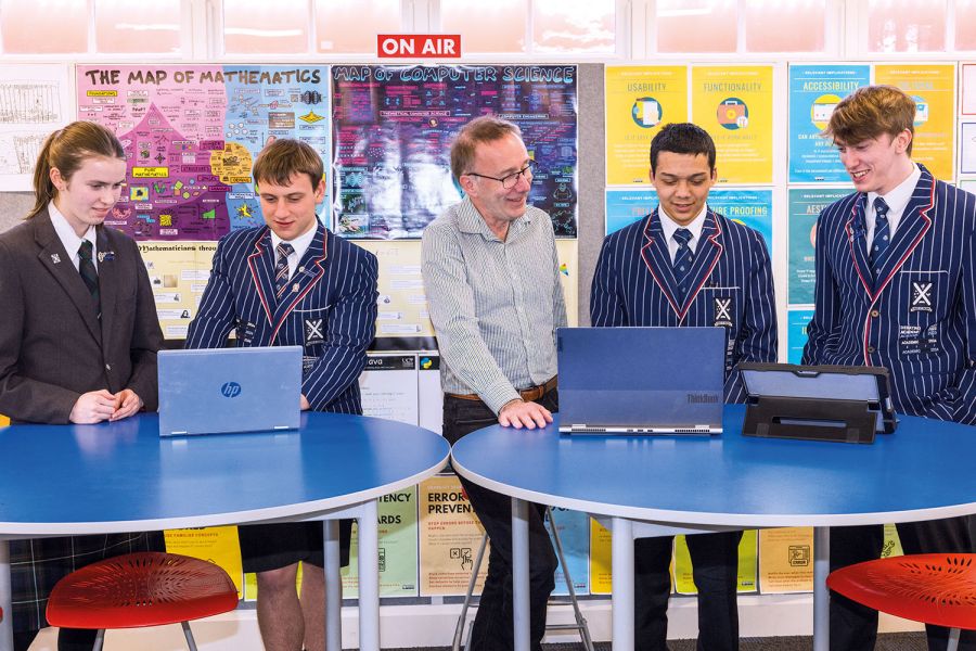 Mentor, Bryn Lewis (Old Collegian 1984), helping St Andrew's College Digital Technology students, Grace Kempthorne, Joe Mundy, Aaron Moore and James Hart with their scholarship projects.