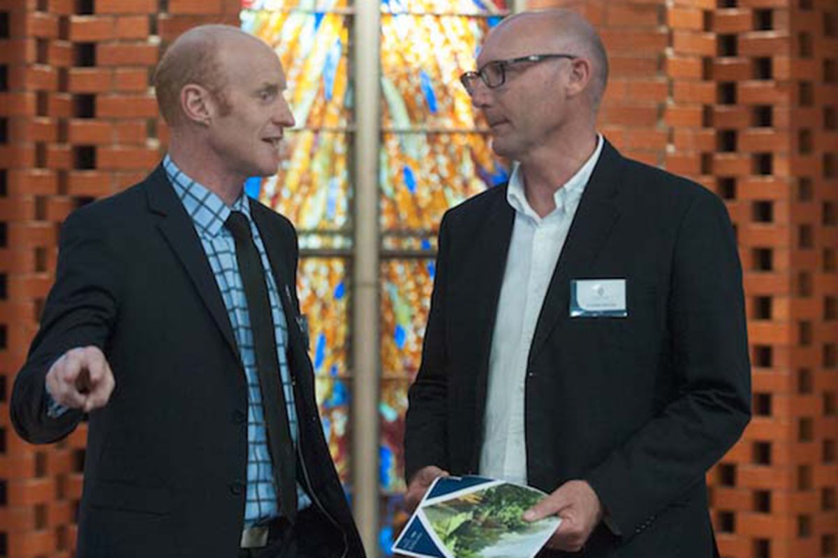 Chaplain, Rev. Paul Morrow with 2G+ event attendee in the Centennial Chapel