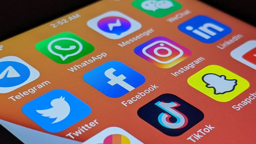 Phone displaying various social media apps.