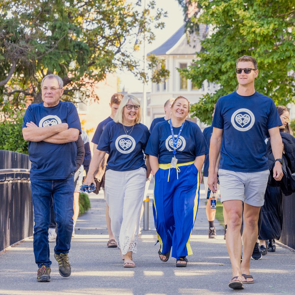 Boarding staff walking towards chapel.