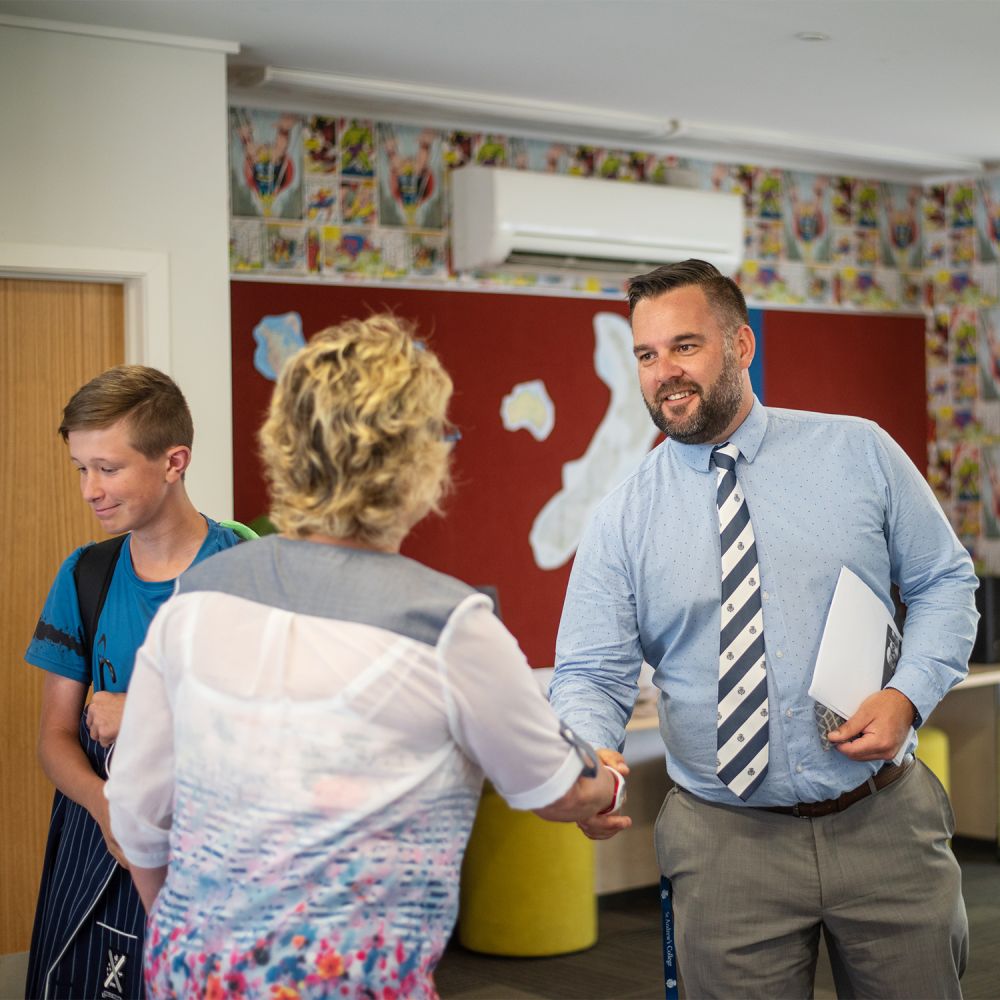 Director of Boarding welcoming family to MacGibbon Boarding House.