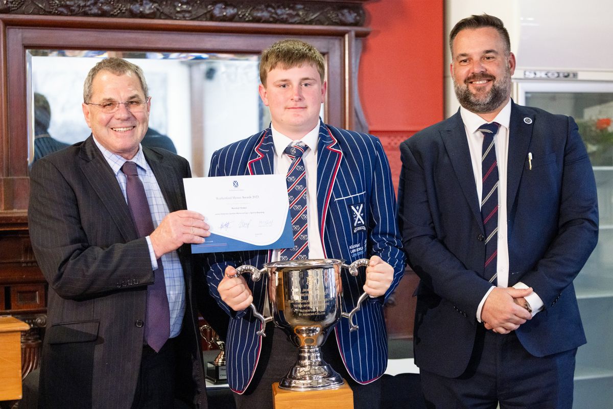 Director of Boarding awarding boarding house cup.