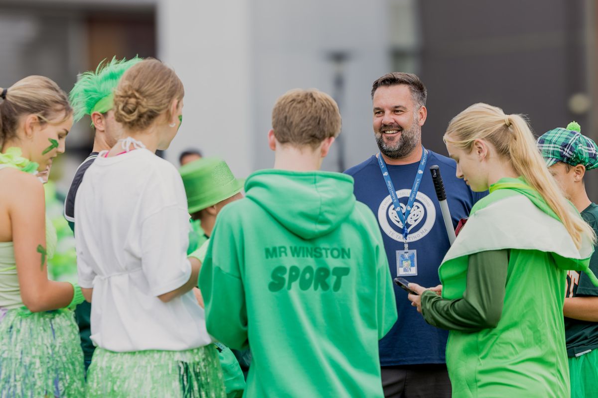 Director of Boarding with students during house competition.