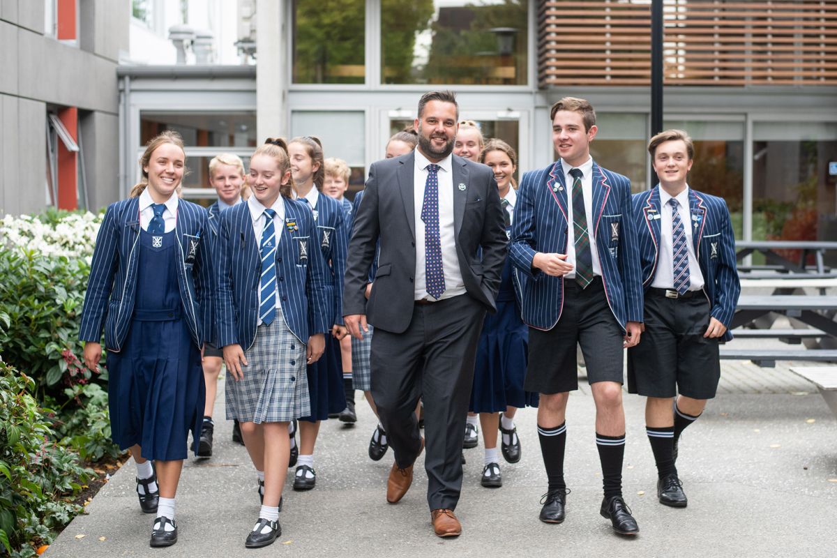 Matt Parr with students outside the boarding houses.